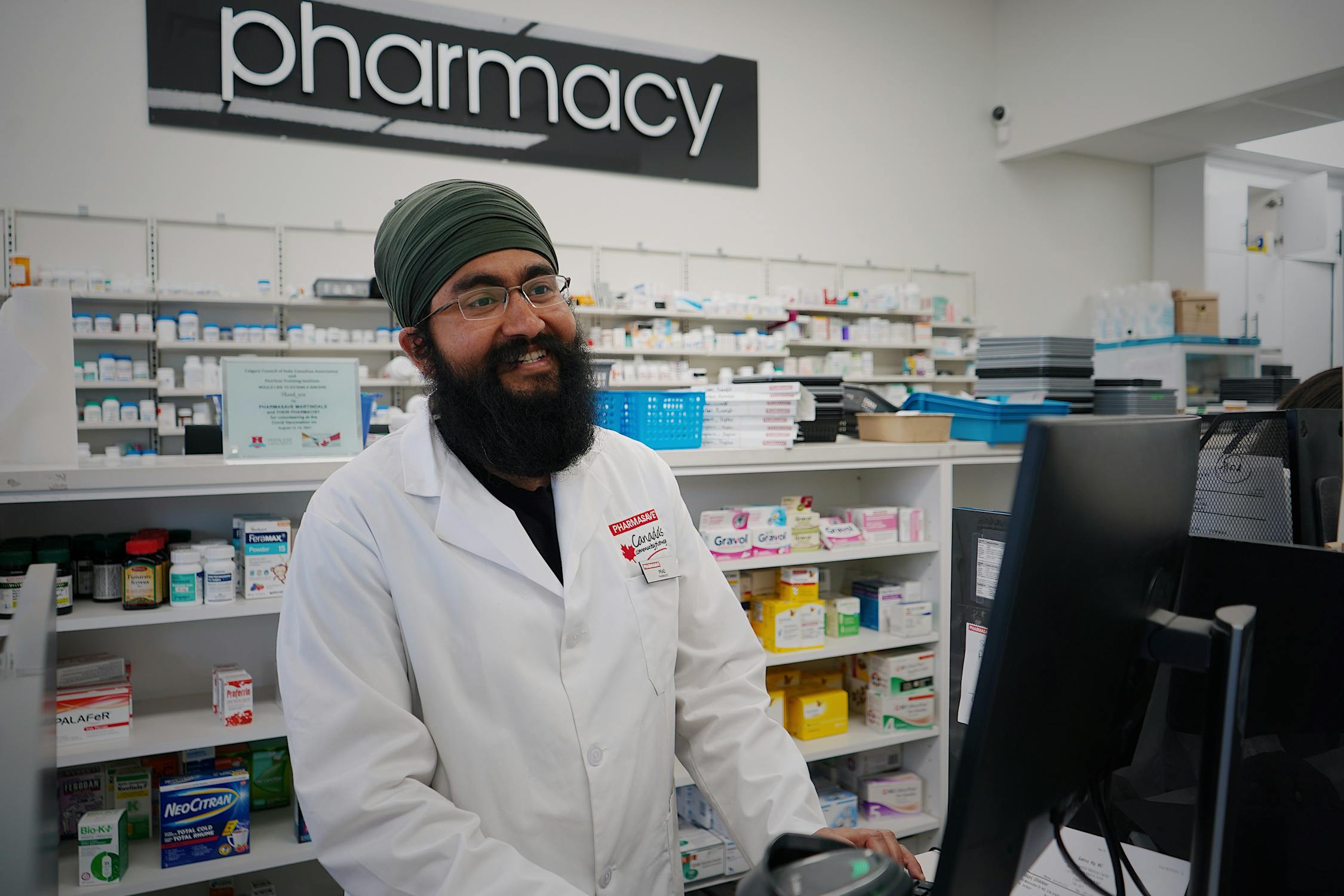 Friendly pharmacist smiling, ready to provide personalized care